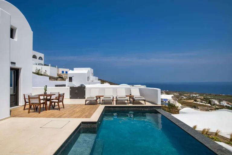 Modern white villa with pool overlooking ocean