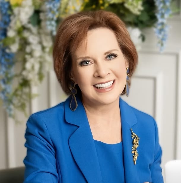 Smiling woman in blue blazer portrait